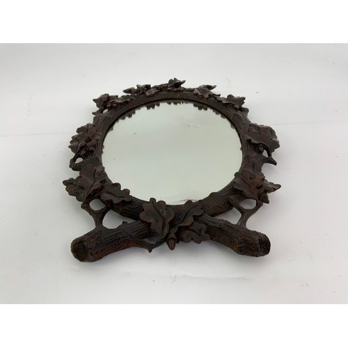 72 - OVAL MIRROR WITH CARVED WOODEN FRAME