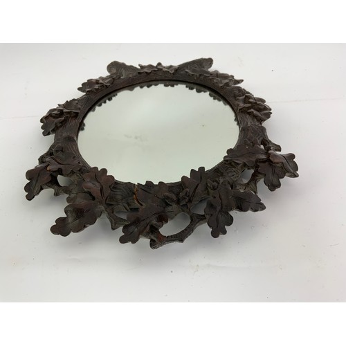 72 - OVAL MIRROR WITH CARVED WOODEN FRAME