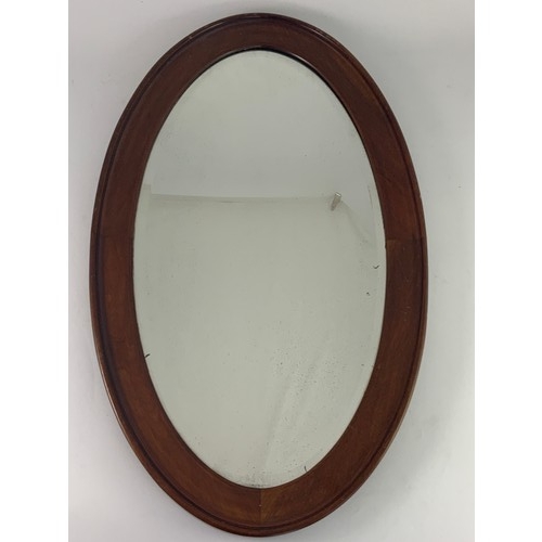 71 - OVAL BEVELLED MIRROR WITH MAHOGANY FRAME