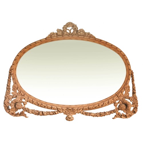 62 - OVAL MIRROR IN AN IMPRESSIVE GILT WOOD FLORENTINE STYLE FRAME, APPROX. 135 X 104 cm OVERALL