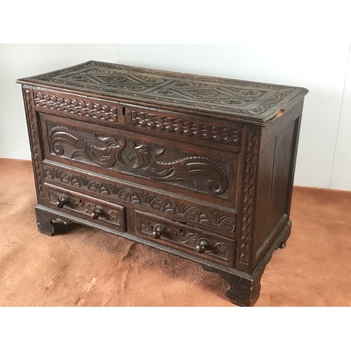 27 - HEAVILY CARVED OAK MULE CHEST WITH 2 DRAWERS AT BASE, CARVED PANELS APPROX 120 CM WIDE