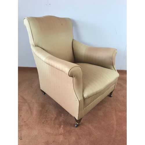 242 - LOUNGE CHAIR WITH SQUARE TAPERED LEGS AND BRASS CASTERS