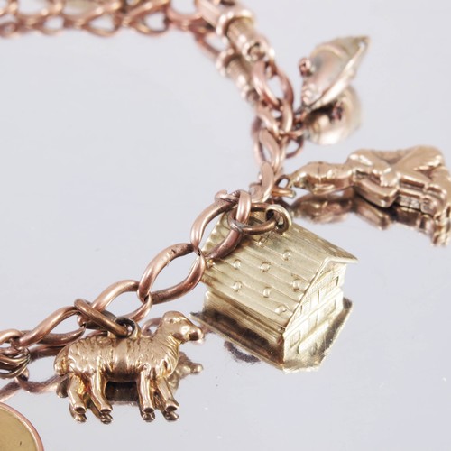 674 - 9ct GOLD CHARM BRACELET AND CHARMS, APPROX. 27.5g GROSS