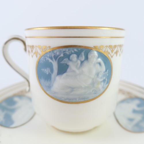 126 - FINE QUALITY MINTON PATE SUR PATE CUP AND SAUCER IN THE MANNER OF ALBOINE BIRKS, OVAL BLUE PANELS DE... 