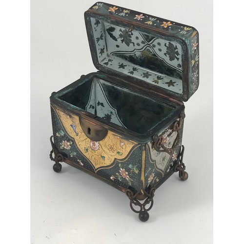 75 - GOOD QUALITY RECTANGULAR GLASS CASKET ORNATELY DECORATED AND HAVING HINGED LID AND GILT METAL MOUNTS