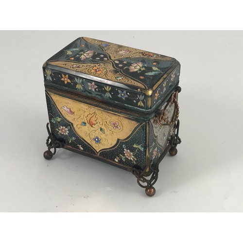 75 - GOOD QUALITY RECTANGULAR GLASS CASKET ORNATELY DECORATED AND HAVING HINGED LID AND GILT METAL MOUNTS