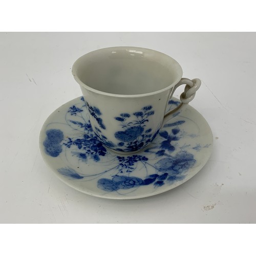 144 - ORIENTAL CUP AND SAUCER