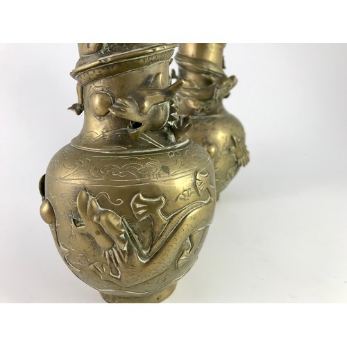 256 - PAIR OF RELIEF DECORATED ORIENTAL VASES