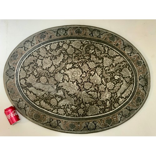 249 - A MASSIVE OVAL INDIAN TRAY PROFUSELY DECORATED WITH FOLIAGE AND BEASTS, approx. 100 x 74 cm