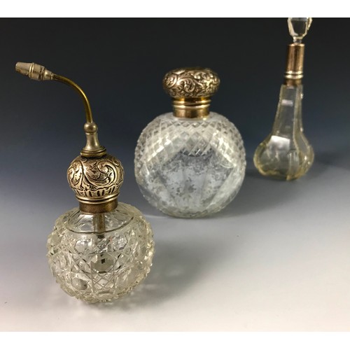 381 - VARIOUS PERFUME AND OTHER BOTTLES WITH SILVER TOPS AND COLLARS INCLUDING A PERFUME ATOMISER