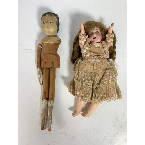 37 - ANTIQUE BISQUE HEAD AND WOODEN DOLLS MANY IN ORIGINAL LACE COSTUME INCLUDING MINIATURE DUTCH TYPE WO... 