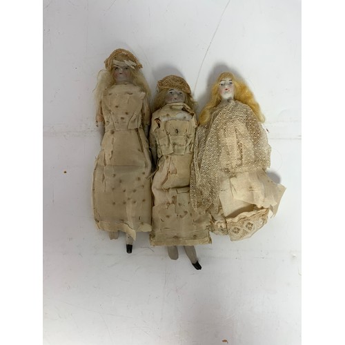 37 - ANTIQUE BISQUE HEAD AND WOODEN DOLLS MANY IN ORIGINAL LACE COSTUME INCLUDING MINIATURE DUTCH TYPE WO... 