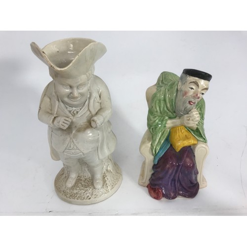 160 - WHITE GLAZED TOBY JUG AND ONE OTHER JUG IN THE FORM OF A SEATED ORIENTAL GENTLEMAN