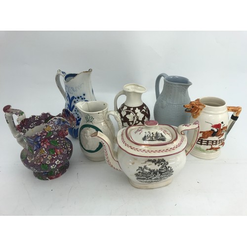 143 - COLLECTION OF JUGS AND A SUNDERLAND LUSTRE TEA POT, ALL AF