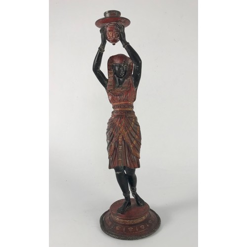 434 - SPELTER CANDLESTICK FIGURE IN THE FORM OF AN EGYPTIAN LADY