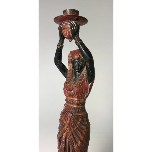 434 - SPELTER CANDLESTICK FIGURE IN THE FORM OF AN EGYPTIAN LADY