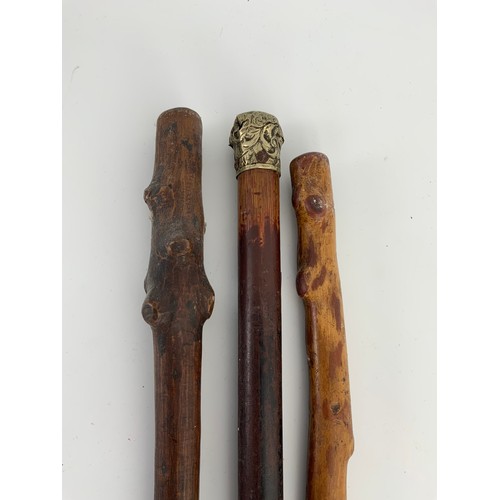 409 - OAK GALLERIED TRAY AND 3 WALKING STICKS