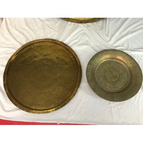 339 - 3 LARGE BRASS TRAYS APPROX 90CMS IN DIAMETER, 64CMS IN DIAMETER AND 43CMS IN DIAMETER