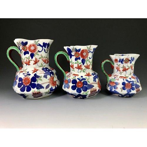 185 - GRADUATED SET OF 3 MASONS TYPE JUGS, MARKED IRONSTONE CHINA.