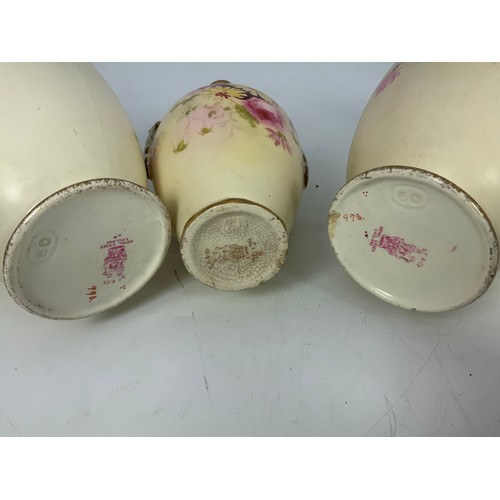 174 - A PAIR AND ONE OTHER BLUSH IVORY VASES