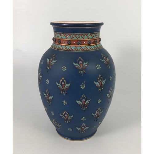 175 - LATE 19TH CENTURY METTLACH VASE DECORATED WITH STYLISED FLOWERS ON A BLUE GROUND. APPROX. 23cm TALL.