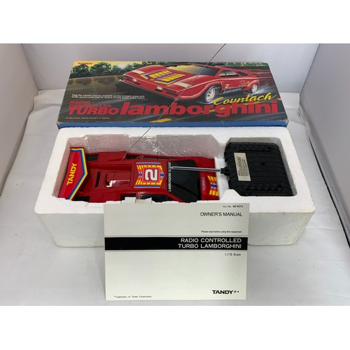 91 - BOXED RADIO CONTROL TURBO LAMBORGHINI COUNTACH & A COSMOTRON COSMIC TREKKER WITH REMOTE CONTROL, BOT... 