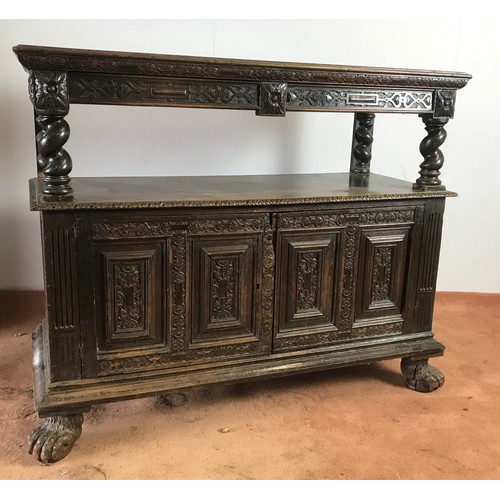 129 - 17TH CENTURY STYLE OAK BUFFET WITH CARVED DECORATION ON HAIRY PAW FEET APPROX 146 cm