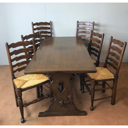 105 - OAK DINING TABLE AND 6 RUSH SEATED CHAIRS