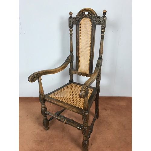 382 - OAK ARM CHAIR WITH BERGERE BACK AND SEAT WITH CARVED ARMS AND LEGS