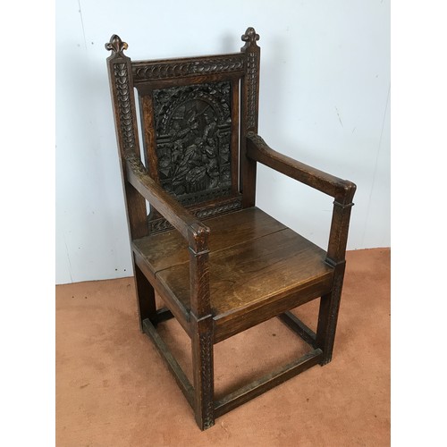 103 - CARVED OAK ARM CHAIR DEPICTING BIRTH SCENE