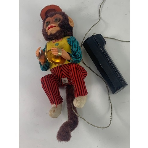 60 - TIN PLATE, A VINTAGE BATTERY OPERATED REMOTE CONTROL FRIENDLY JOCKO MONKEY, MADE IN JAPAN BY ALPS