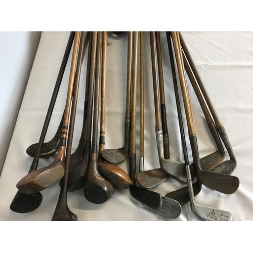 556 - LARGE SELECTION OF HICKORY SHAFT GOLF CLUBS, INCLUDING IRONS AND WOODS.