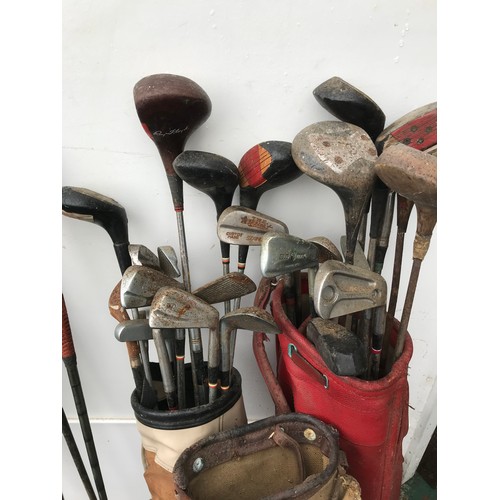 558 - LARGE COLLECTION OF GOLF CLUBS AND THREE BAGS