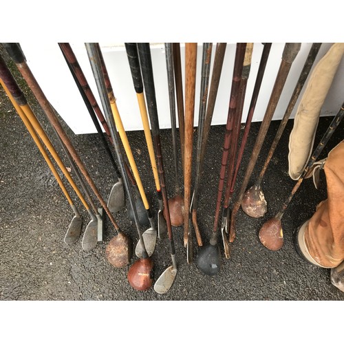 558 - LARGE COLLECTION OF GOLF CLUBS AND THREE BAGS