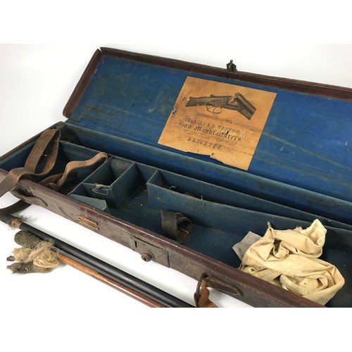 560 - OLD LEATHER GUN CASE AND GUN CLEANING RODS