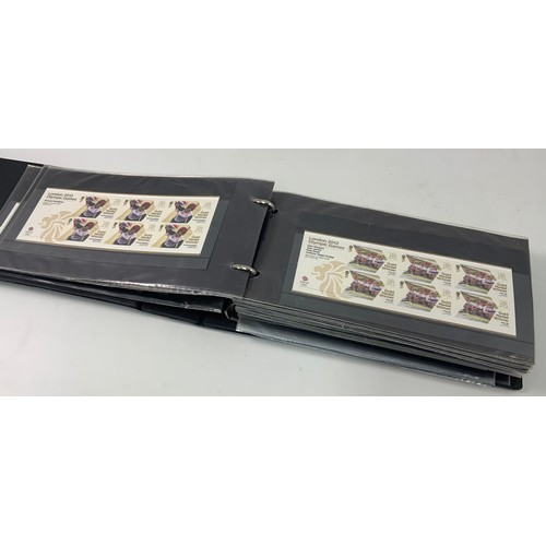 286 - BLACK MERLIN ALBUM WITH 126 X 2012 GOLD MEDAL WINNERS STAMPS IN SHEETLETS AND PAIRS PLUS OTHER UK SH... 