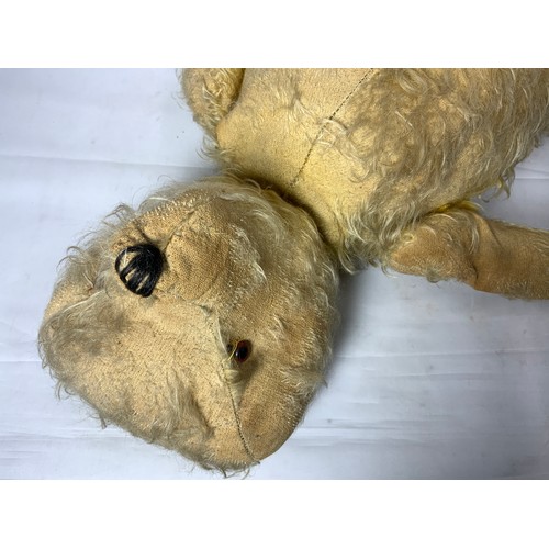 66 - LARGE VINTAGE STRAW FILLED TEDDY BEAR, BLACK NOSE T/W A VINTAGE STRAW FILLED DOG