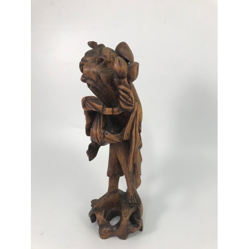 190 - CARVED ORIENTAL HARDWOOD FIGURE OF A MAN