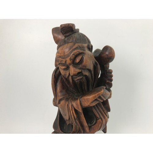 190 - CARVED ORIENTAL HARDWOOD FIGURE OF A MAN