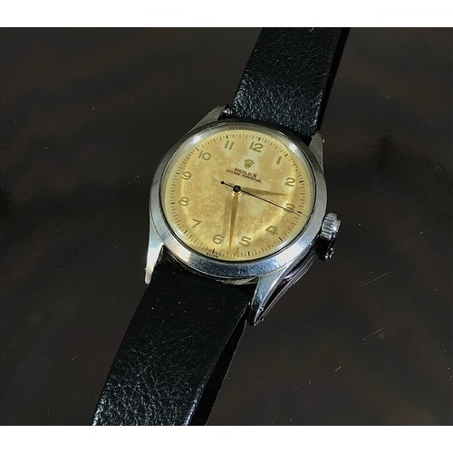 402 - ROLEX, A GENTS VINTAGE OYSTER PERPETUAL WRIST WATCH, CIRCA 1957, 34 mm WITH CREAM DIAL, ARABIC NUMER... 