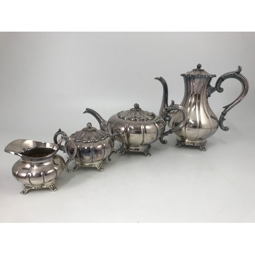 296 - 4 PIECE SILVER PLATED MELON SHAPED TEA SET ON PLATED TRAY