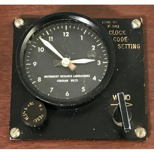 65 - MILITARY CLOCK IN WOODEN DISPLAY STAND INSTRUMENT RESEARCH LABORATORY, COSHAM, WILTSHIRE