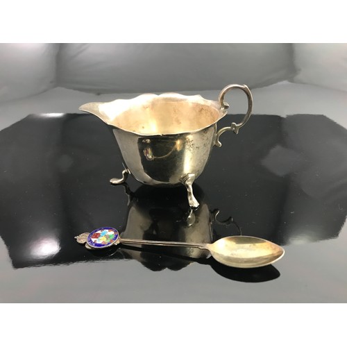 335 - SILVER CREAM JUG AND SPOON