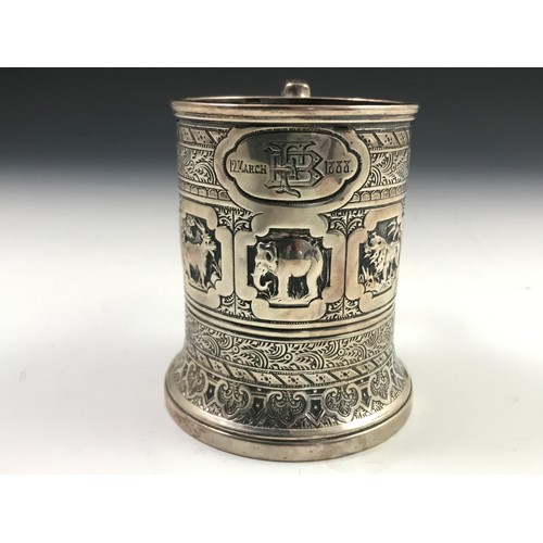 350 - HEAVILY EMBOSSED SILVER TANKARD DEPICTING INDIAN SCENES, approx. 144g, marked Hall & Co. Manchester ... 