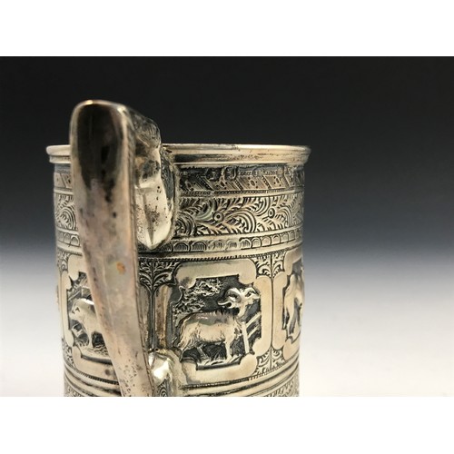 350 - HEAVILY EMBOSSED SILVER TANKARD DEPICTING INDIAN SCENES, approx. 144g, marked Hall & Co. Manchester ... 