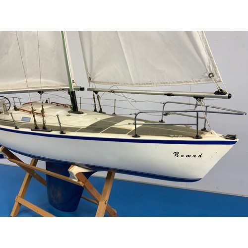 24 - RADIO CONTROLLED YACHT, NOMAD, APPROX. 90 cm LONG.