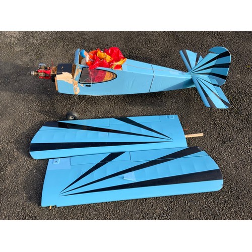 46 - RADIO CONTROLLED MODEL AIRCRAFT - BLUE G-BSER, MONOPLANE WITH PARACHUTIST. SOR, APPROX 180 cm LONG.