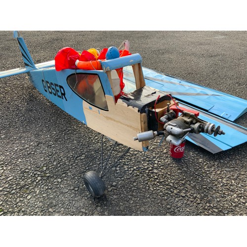 46 - RADIO CONTROLLED MODEL AIRCRAFT - BLUE G-BSER, MONOPLANE WITH PARACHUTIST. SOR, APPROX 180 cm LONG.