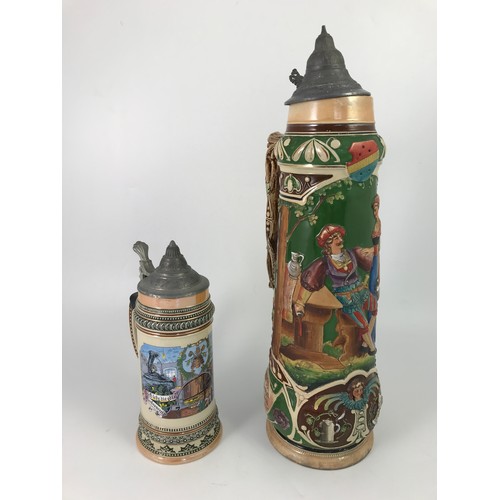 199 - 2 STEINS, ONE OF WHICH IS VERY LARGE, LARGER ONE IS APPROX 51CM TALL