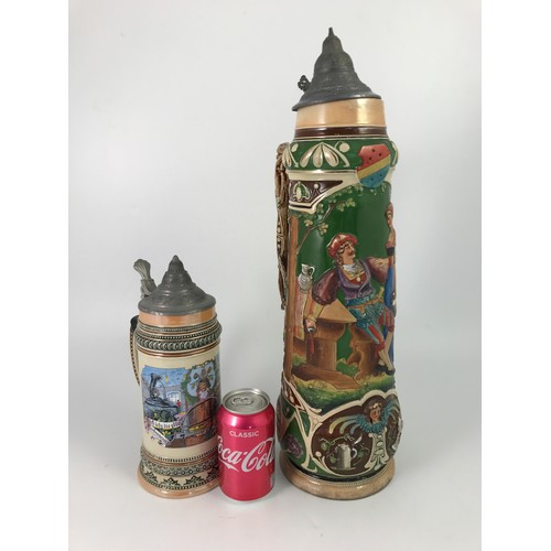 199 - 2 STEINS, ONE OF WHICH IS VERY LARGE, LARGER ONE IS APPROX 51CM TALL